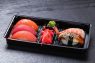 Unagi, shrimp, fresh salmon, tuna in plastic delivery box