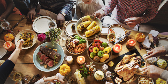 People Celebrating Thanksgiving meals on table