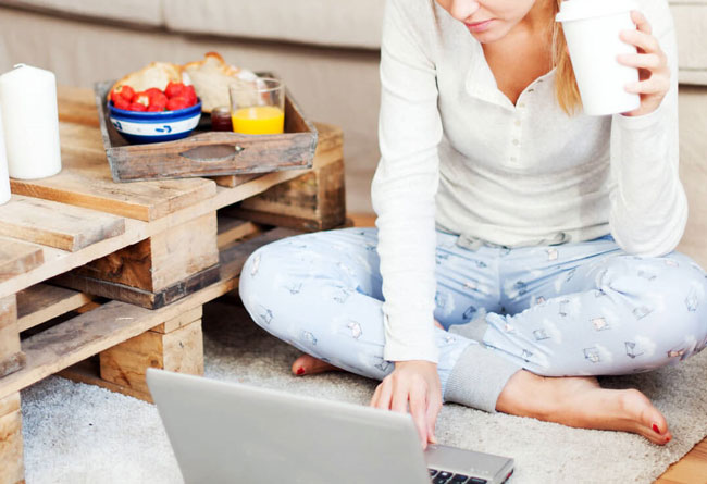 Doordash women order meals over laptop computer